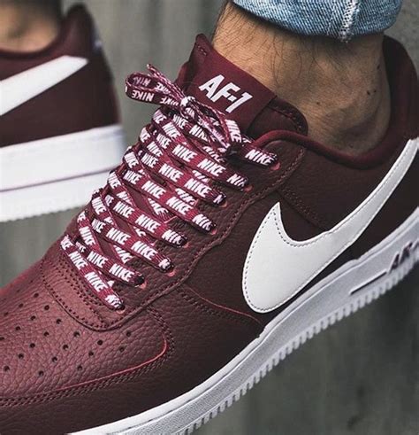 maroon and white Nike shoes